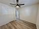 Bright and airy bedroom with a ceiling fan, closet, and contemporary flooring at 2721 7Th W St, Bradenton, FL 34205