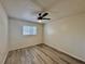 Spacious bedroom features a ceiling fan and ample natural light from a window at 2721 7Th W St, Bradenton, FL 34205