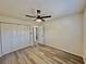 Spacious bedroom with ample closet space, ceiling fan, and modern flooring at 2721 7Th W St, Bradenton, FL 34205