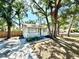 Charming single-story home nestled amongst mature trees, with a inviting front porch at 2721 7Th W St, Bradenton, FL 34205