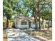 Charming single-story home with a front porch, inviting curb appeal, and beautiful trees at 2721 7Th W St, Bradenton, FL 34205