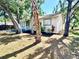 Quaint one-story home featuring a well-maintained lawn and mature trees at 2721 7Th W St, Bradenton, FL 34205