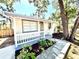 Charming single-story home with a cozy front porch and beautifully landscaped front yard at 2721 7Th W St, Bradenton, FL 34205