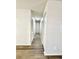 Hallway featuring new laminate floors, neutral paint, and convenient access to other rooms at 2721 7Th W St, Bradenton, FL 34205