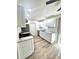 Modern kitchen boasts sleek white cabinets, stainless steel appliances, and stylish backsplash at 2721 7Th W St, Bradenton, FL 34205