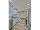 Bright kitchen boasts white cabinetry, stainless steel appliances, and wood-look floors at 2721 7Th W St, Bradenton, FL 34205