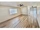 Bright living room features new floors, ceiling fans, and large windows that allow ample natural light at 2721 7Th W St, Bradenton, FL 34205