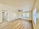 Bright living room offers modern floors, ceiling fan, and plentiful light at 2721 7Th W St, Bradenton, FL 34205