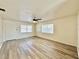 Bright living room features modern floors, ceiling fan, and inviting natural light at 2721 7Th W St, Bradenton, FL 34205