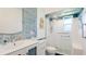 Modern bathroom featuring glass enclosed shower, updated fixtures, and vanity sink at 3213 Cambridge Ave, Bradenton, FL 34207