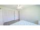Bright bedroom featuring ceiling fan, updated floors and white closet doors at 3213 Cambridge Ave, Bradenton, FL 34207