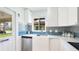 Bright kitchen with stainless steel dishwasher, custom tile backsplash, and ample counter space at 3213 Cambridge Ave, Bradenton, FL 34207