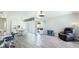 Bright living room features modern ceiling fan, dining area, and comfortable seating at 3213 Cambridge Ave, Bradenton, FL 34207