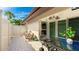 Cozy outdoor patio with tiled flooring, a dining set, and a privacy fence, perfect for relaxing and entertaining at 3213 Cambridge Ave, Bradenton, FL 34207