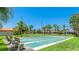 Shuffleboard courts surrounded by palm trees and well-maintained landscaping, ideal for outdoor recreation at 3213 Cambridge Ave, Bradenton, FL 34207