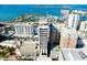Stunning aerial view of luxury building, marina and bay with multiple boats on the water at 33 S Palm Ave # 1602, Sarasota, FL 34236