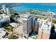 Captivating aerial view featuring luxury building, marina, and bay with multiple boats at 33 S Palm Ave # 1602, Sarasota, FL 34236