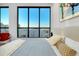 Modern bedroom featuring a large window overlooking city views, complete with contemporary decor and ample light at 33 S Palm Ave # 1602, Sarasota, FL 34236