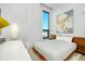 Modern bedroom offers a minimalist design with city views, a sleek desk, and a comfortable sleeping space at 33 S Palm Ave # 1602, Sarasota, FL 34236