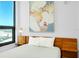 Modern bedroom features a minimalist design with city views and a comfortable bed, perfect for relaxation at 33 S Palm Ave # 1602, Sarasota, FL 34236