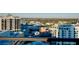 Expansive city view from a high-rise featuring other buildings and greenery against a clear, bright sky at 33 S Palm Ave # 1602, Sarasota, FL 34236
