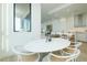 Bright dining area featuring modern furnishings and an open view to the kitchen and living spaces at 33 S Palm Ave # 1602, Sarasota, FL 34236