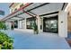 Exterior building entrance with modern awning, glass doors and sidewalk access at 33 S Palm Ave # 1602, Sarasota, FL 34236