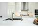 Bright modern kitchen with a large island, sink, and stainless steel appliances at 33 S Palm Ave # 1602, Sarasota, FL 34236