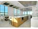 Bright kitchen area featuring a large island, bar seating, and plenty of natural light at 33 S Palm Ave # 1602, Sarasota, FL 34236