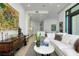 Elegant living room featuring hardwood floors, modern decor, and a glimpse of the kitchen area at 33 S Palm Ave # 1602, Sarasota, FL 34236