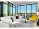 Bright living space with city views from large windows and modern furniture at 33 S Palm Ave # 1602, Sarasota, FL 34236