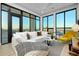Well-lit living area with large windows, a comfortable sofa, and stylish furniture creating a cozy ambiance at 33 S Palm Ave # 1602, Sarasota, FL 34236