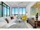 Bright living room featuring large windows, comfortable seating, and views of the cityscape at 33 S Palm Ave # 1602, Sarasota, FL 34236