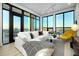 Bright living room featuring modern decor, floor to ceiling windows and city views at 33 S Palm Ave # 1602, Sarasota, FL 34236