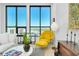 Bright living room with expansive windows offering panoramic city views and stylish, modern furnishings at 33 S Palm Ave # 1602, Sarasota, FL 34236