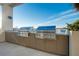 Rooftop outdoor kitchen area featuring built-in stainless steel grills and scenic views at 33 S Palm Ave # 1602, Sarasota, FL 34236