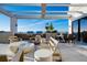 Comfortable rooftop outdoor lounge featuring modern seating, dining table and built-in cooking grills at 33 S Palm Ave # 1602, Sarasota, FL 34236