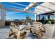Rooftop outdoor lounge with stylish seating, built-in grills, and clear sky views at 33 S Palm Ave # 1602, Sarasota, FL 34236