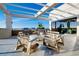 Stylish rooftop outdoor lounge with comfortable seating, cooking grills, and stunning scenic views at 33 S Palm Ave # 1602, Sarasota, FL 34236