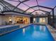 Backyard featuring a pool, spa, patio and water views at 3300 Casey Key Rd, Nokomis, FL 34275