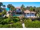 Backyard oasis featuring a private pool, a deck, and lush tropical landscaping at 3300 Casey Key Rd, Nokomis, FL 34275