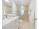 Elegant bathroom with a walk-in shower, and a vanity with lots of counter space at 3300 Casey Key Rd, Nokomis, FL 34275
