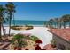 Property boasts private beach access and beautiful landscaping at 3300 Casey Key Rd, Nokomis, FL 34275
