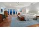 Bright bedroom featuring water view, terracotta floor, and coastal decor at 3300 Casey Key Rd, Nokomis, FL 34275