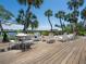 A backyard deck with white seating and views of the water at 3300 Casey Key Rd, Nokomis, FL 34275