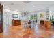 Bright dining area featuring Saltillo tile and access to the Gathering room at 3300 Casey Key Rd, Nokomis, FL 34275
