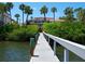 Stunning coastal home with private dock, lush landscaping, and picturesque waterfront views at 3300 Casey Key Rd, Nokomis, FL 34275