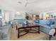 Spacious living room with large windows, comfortable seating, and stylish décor at 3300 Casey Key Rd, Nokomis, FL 34275