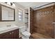 Bathroom featuring mosaic-tiled shower and updated vanity at 3301 62Nd Street W Cir, Bradenton, FL 34209