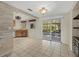 Bright kitchen with a wet bar and sliding glass doors leading to patio at 3301 62Nd Street W Cir, Bradenton, FL 34209